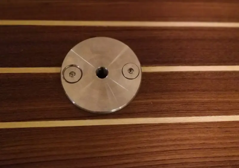 A fitted mounting point in a teak swim platform