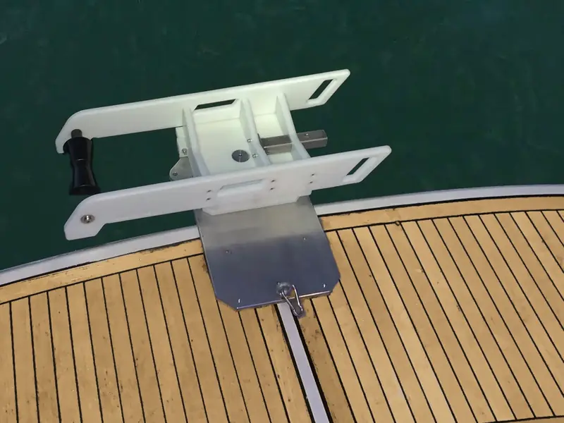QR 250 Special mounted on a teak swim platform, with the cradle tilted out towards the water